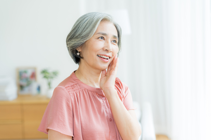 Senior woman doing skin care